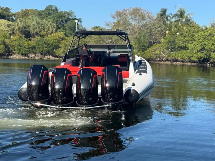  Yacht Photos Pics 2024 Goldfish 46 Open boat with four powerful outboard engines on a serene waterway.