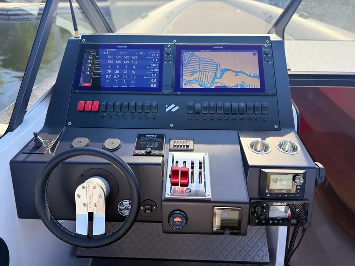 Yacht Photos Pics 2024 Goldfish 46 Open boat dashboard with navigation screens and controls.