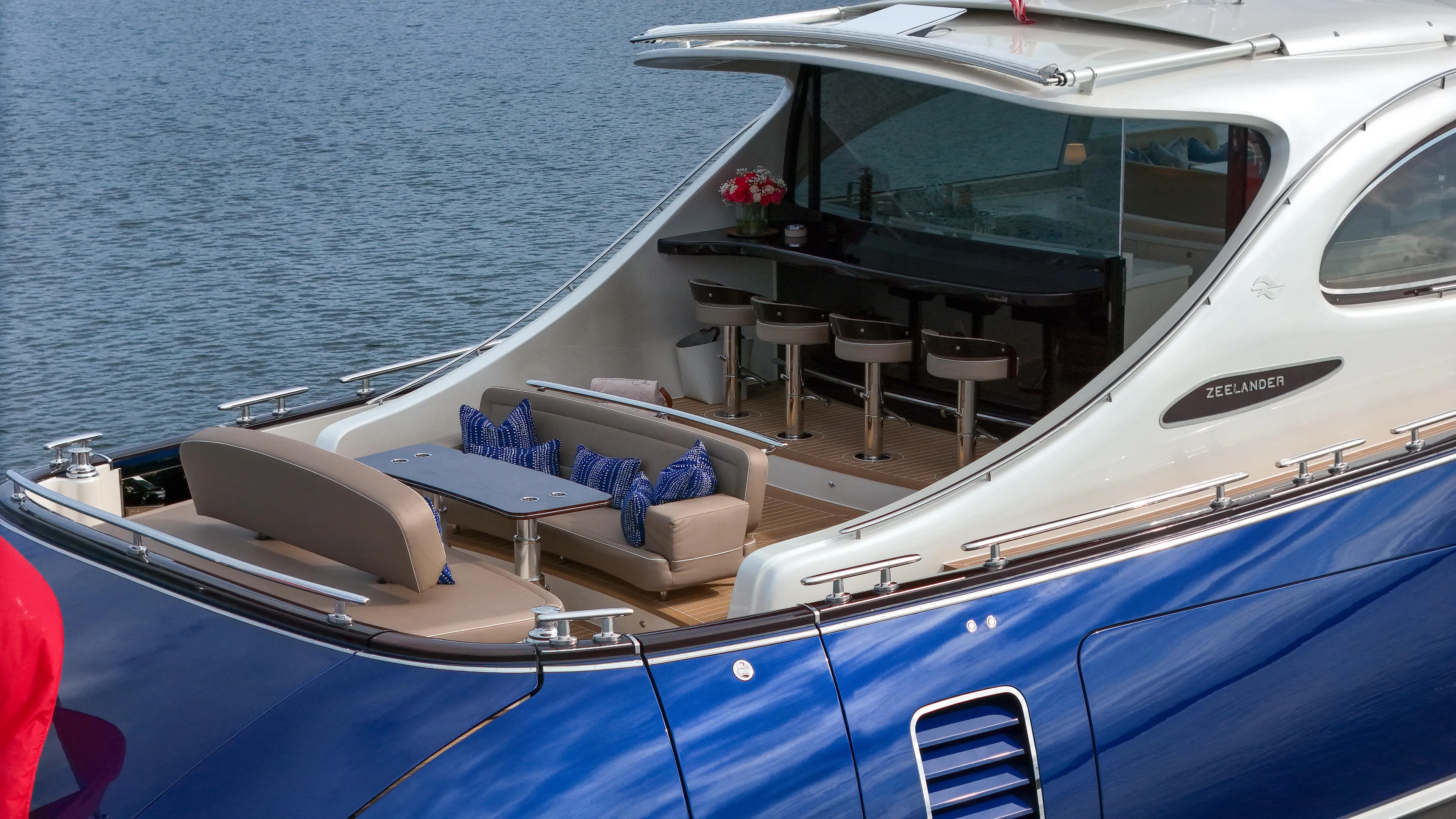 Maddamc2 Yacht Photos Pics Zeelander 72 yacht 2023 model, luxurious outdoor seating and bar area on the water.