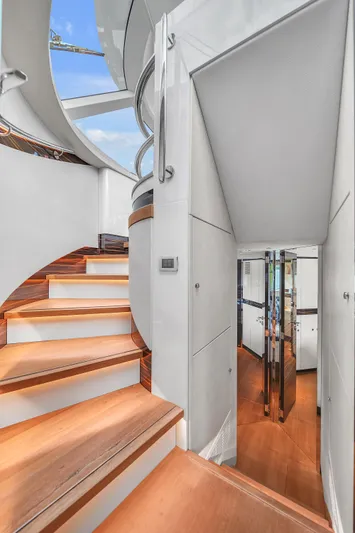 Maddamc2 Yacht Photos Pics Interior staircase of 2023 Zeelander 72 yacht with modern design and wooden steps.