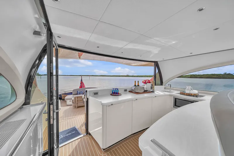 Maddamc2 Yacht Photos Pics Luxurious interior of 2023 Zeelander 72 yacht with open deck and scenic water view.