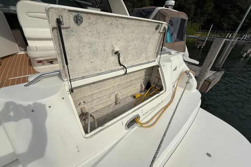Seascape Yacht Photos Pics Open storage compartment on 1998 Sea Ray 400 Sundancer boat docked at marina.