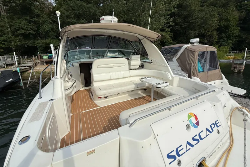 Seascape Yacht Photos Pics 1998 Sea Ray 400 Sundancer yacht docked, featuring spacious seating and elegant design.