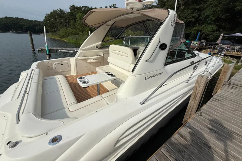 Seascape Yacht Photos Pics 1998 Sea Ray 400 Sundancer docked, featuring spacious seating and sleek design.