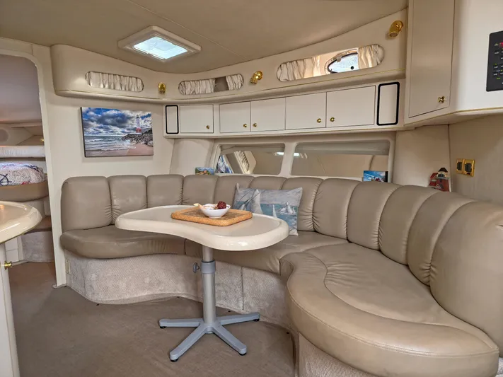 Seascape Yacht Photos Pics Luxurious interior of 1998 Sea Ray 400 Sundancer yacht with plush seating and elegant decor.