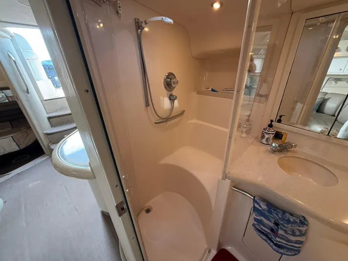 Seascape Yacht Photos Pics Bathroom interior of 1998 Sea Ray 400 Sundancer yacht, featuring shower and sink.