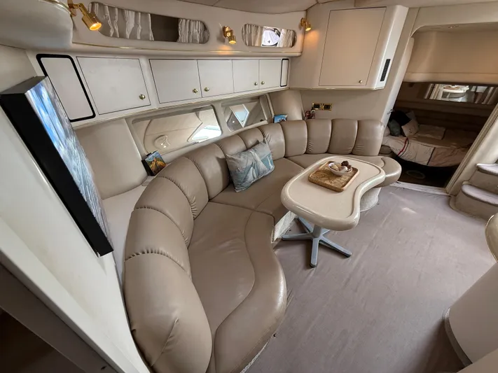 Seascape Yacht Photos Pics Luxurious interior of a 1998 Sea Ray 400 Sundancer yacht with plush seating and elegant decor.
