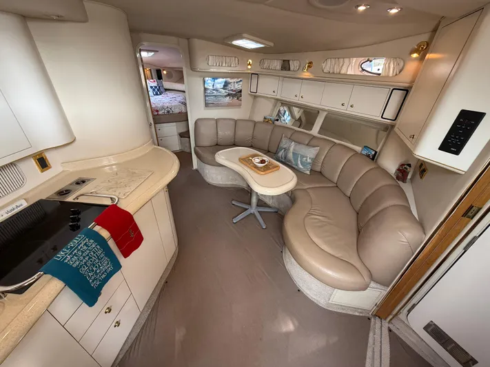 Seascape Yacht Photos Pics Luxurious interior of 1998 Sea Ray 400 Sundancer yacht with leather seating and kitchenette.