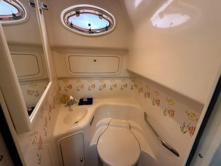 Seascape Yacht Photos Pics Bathroom interior of 1998 Sea Ray 400 Sundancer yacht with nautical decor.