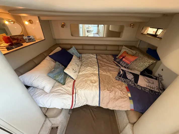 Seascape Yacht Photos Pics Cozy cabin interior of 1998 Sea Ray 400 Sundancer with comfortable bedding and nautical decor.