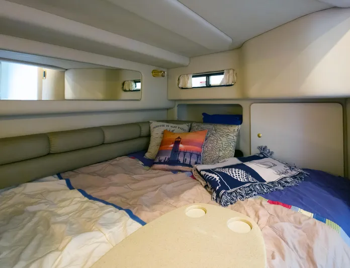 Seascape Yacht Photos Pics Cozy cabin interior of 1998 Sea Ray 400 Sundancer with comfortable bedding and decorative pillows.