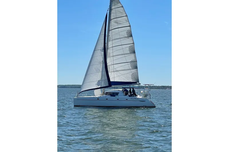 Three Seas Yacht Photos Pics 2002 Fountaine Pajot Belize 43 catamaran sailing on a sunny day.