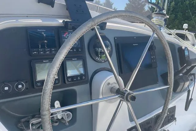 Three Seas Yacht Photos Pics Steering wheel and navigation instruments on 2002 Fountaine Pajot Belize 43 catamaran.