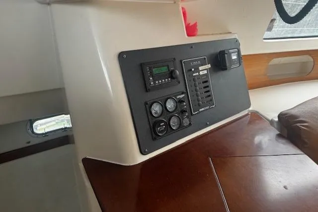 Three Seas Yacht Photos Pics Control panel inside 2002 Fountaine Pajot Belize 43 catamaran, featuring gauges and switches.