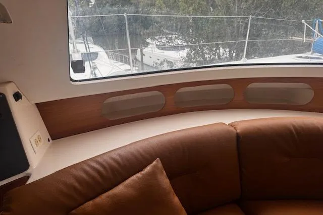 Three Seas Yacht Photos Pics Interior of 2002 Fountaine Pajot Belize 43 yacht with brown leather seating.