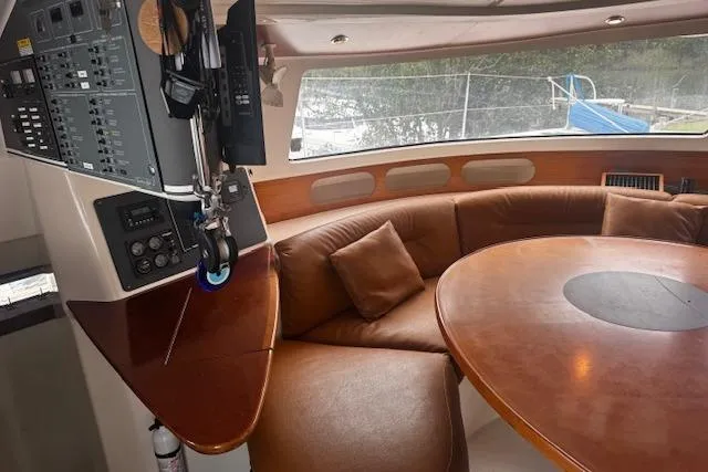 Three Seas Yacht Photos Pics Interior of 2002 Fountaine Pajot Belize 43 yacht with leather seating and control panel.