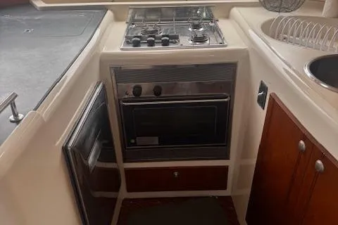 Three Seas Yacht Photos Pics 2002 Fountaine Pajot Belize 43 yacht kitchen with stove, oven, and sink.