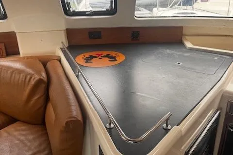 Three Seas Yacht Photos Pics Interior of 2002 Fountaine Pajot Belize 43 catamaran with leather seating and countertop.