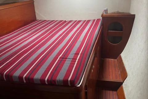 Three Seas Yacht Photos Pics Cozy cabin interior of 2002 Fountaine Pajot Belize 43 with striped bedding.