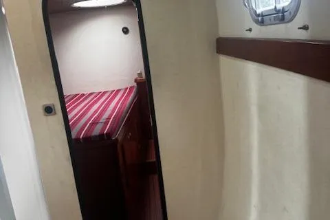 Three Seas Yacht Photos Pics Interior cabin of 2002 Fountaine Pajot Belize 43 with striped bedding.