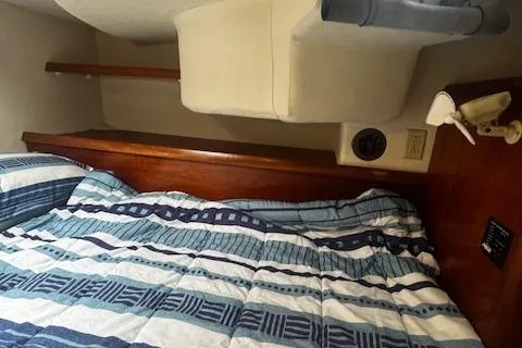 Three Seas Yacht Photos Pics Cozy cabin interior of 2002 Fountaine Pajot Belize 43 with striped bedding.