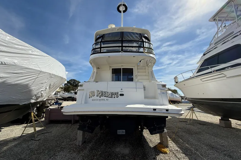  Yacht Photos Pics 2005 Silverton 38 Sport Bridge yacht on dry dock, labeled "No Regrets," Beach Haven, NJ.
