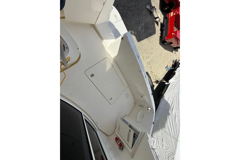  Yacht Photos Pics 2005 Silverton 38 Sport Bridge boat deck with storage hatch and equipment.