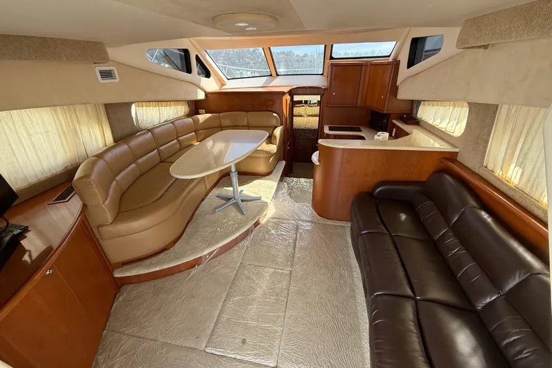  Yacht Photos Pics Luxurious interior of a 2005 Silverton 38 Sport Bridge yacht with leather seating and modern amenities.