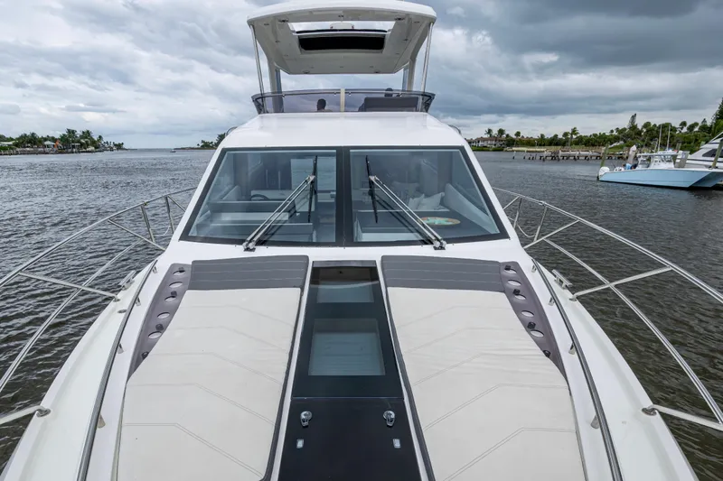 Sunshine Yacht Photos Pics 2020 Galeon 550 Fly yacht on water, showcasing sleek design and spacious deck.