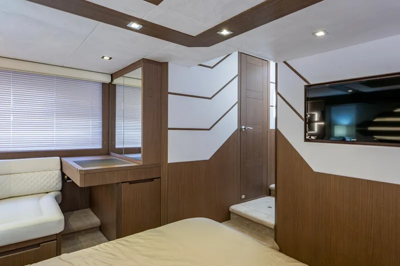 Sunshine Yacht Photos Pics Luxurious interior of 2020 Galeon 550 Fly yacht with modern wood paneling and sleek design.