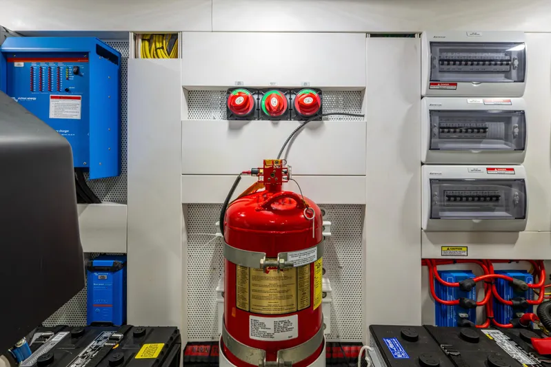 Sunshine Yacht Photos Pics Engine room of 2020 Galeon 550 Fly yacht with fire extinguisher and electrical panels.