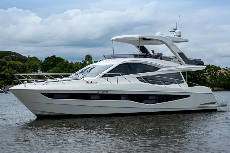 Sunshine Yacht Photos Pics 2020 Galeon 550 Fly yacht on water, showcasing sleek design and modern features.