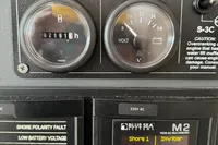 Control panel of a 2020 Leopard 50 boat, displaying voltage and frequency readings.