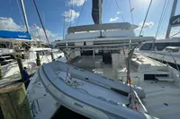 2020 Leopard 50 catamaran docked at marina under clear blue sky.