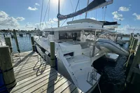 2020 Leopard 50 catamaran docked at marina under sunny skies.