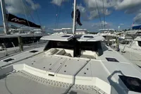 Leopard 50 catamaran, 2020 model, docked at marina under blue sky.