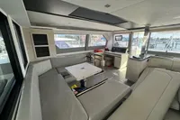 Modern interior of 2020 Leopard 50 yacht with spacious seating and navigation area.