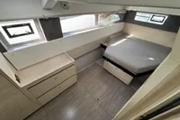 Modern cabin interior of 2020 Leopard 50 yacht with bed and storage.