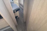 Interior of 2020 Leopard 50 yacht, featuring modern wood paneling and compact design.