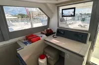 Interior of 2020 Leopard 50 yacht with navigation station and marina view.