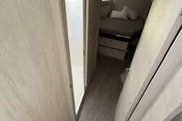 Interior of 2020 Leopard 50 yacht, featuring a cozy bedroom and modern design.