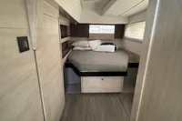 Interior of 2020 Leopard 50 yacht cabin with bed and modern design.