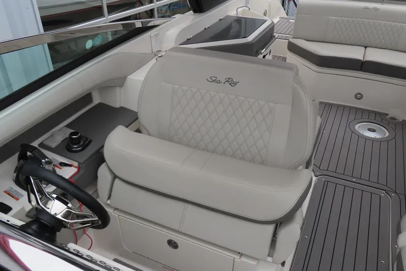  Yacht Photos Pics 2021 Sea Ray 310 SLX boat interior with luxurious seating and modern steering console.