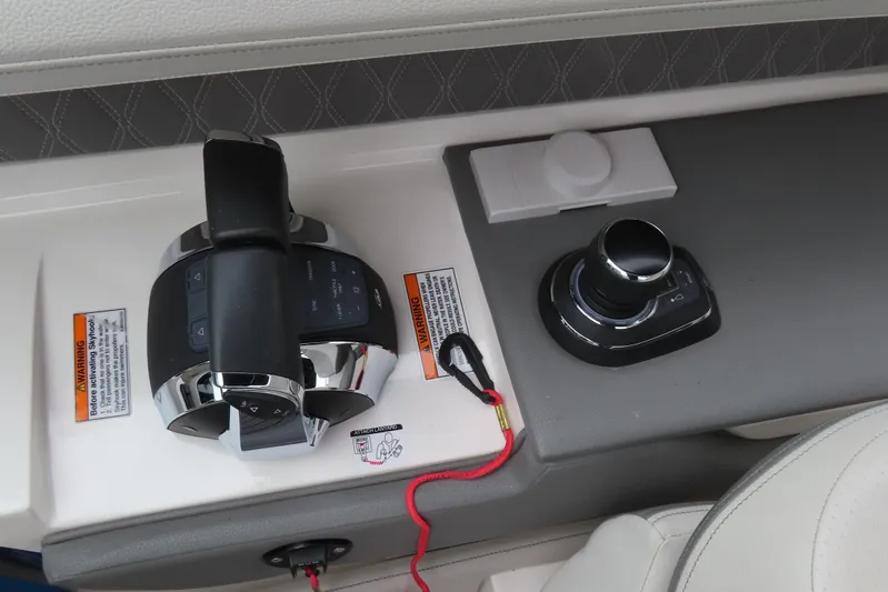  Yacht Photos Pics Control panel of a 2021 Sea Ray 310 SLX boat with throttle and joystick.