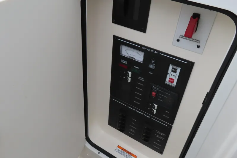  Yacht Photos Pics Electrical panel on a 2021 Sea Ray 310 SLX boat, featuring various switches and controls.