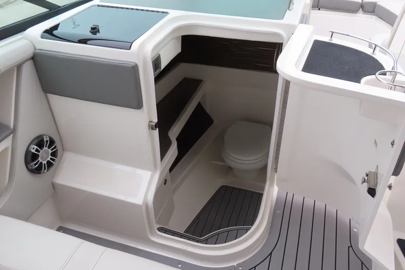  Yacht Photos Pics 2021 Sea Ray 310 SLX boat interior with a compact bathroom and modern design.