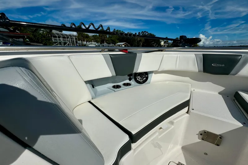No Joke Yacht Photos Pics 2022 Robalo R360 Center Console boat interior with white seating and speaker.