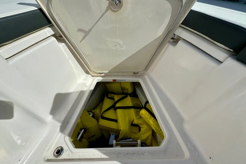 No Joke Yacht Photos Pics Storage compartment on 2022 Robalo R360 Center Console with yellow life jackets.
