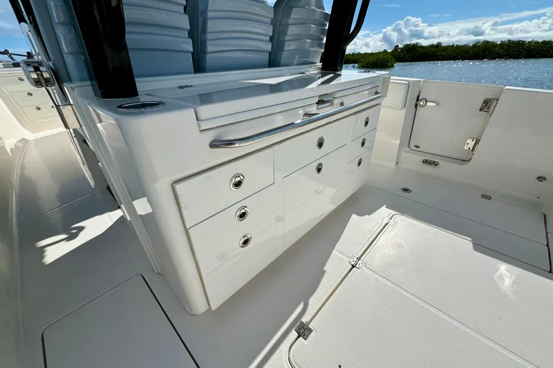 No Joke Yacht Photos Pics 2022 Robalo R360 Center Console boat interior with storage drawers and seating.