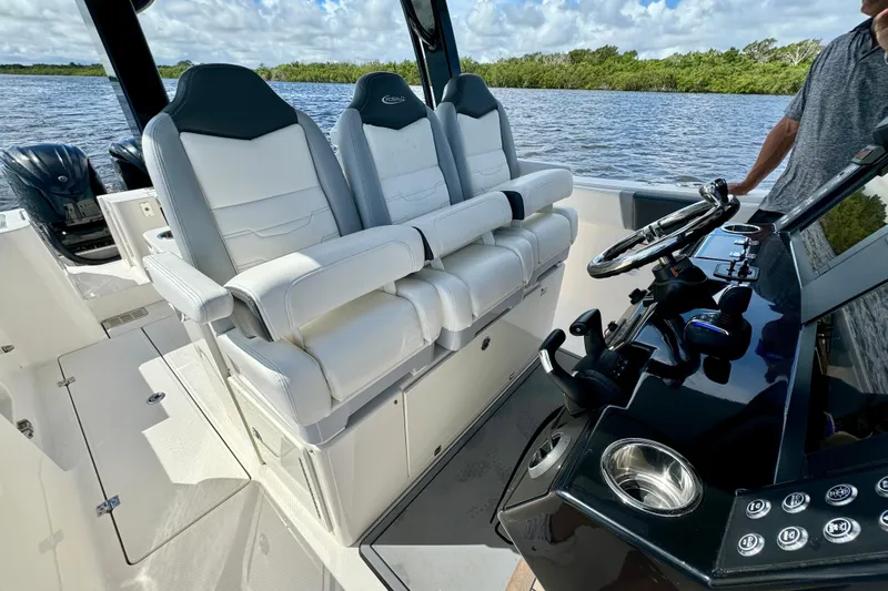 No Joke Yacht Photos Pics 2022 Robalo R360 Center Console boat interior with luxurious seating and modern controls.